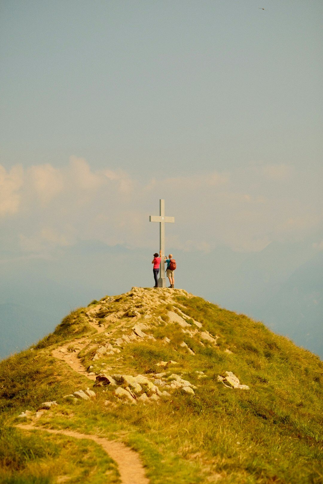 Group of seniors hiking on a mountain trail in Switzerland