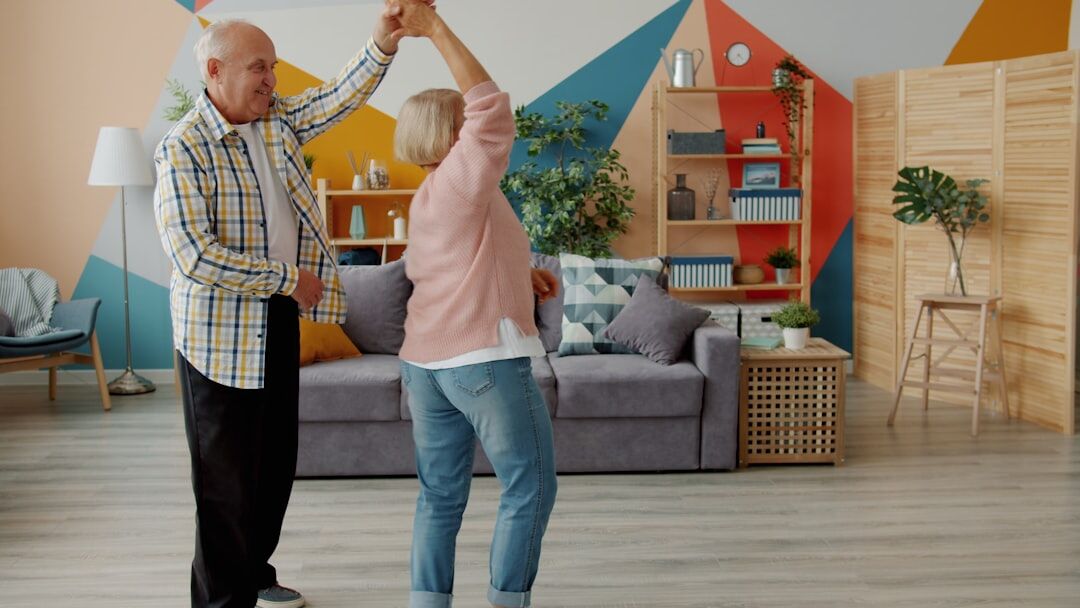 happy elderly couple dancing
