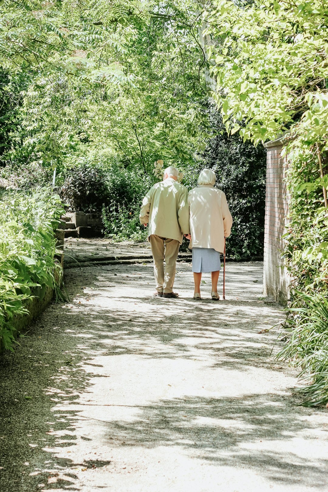 senior couple walking in park